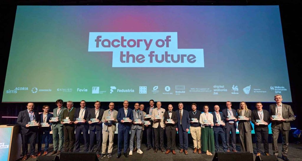 Group of professionals at the Factory of the Future award event, celebrating innovation.