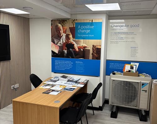 Interior of Sustainable Home Centre with heat pump display and informational posters.