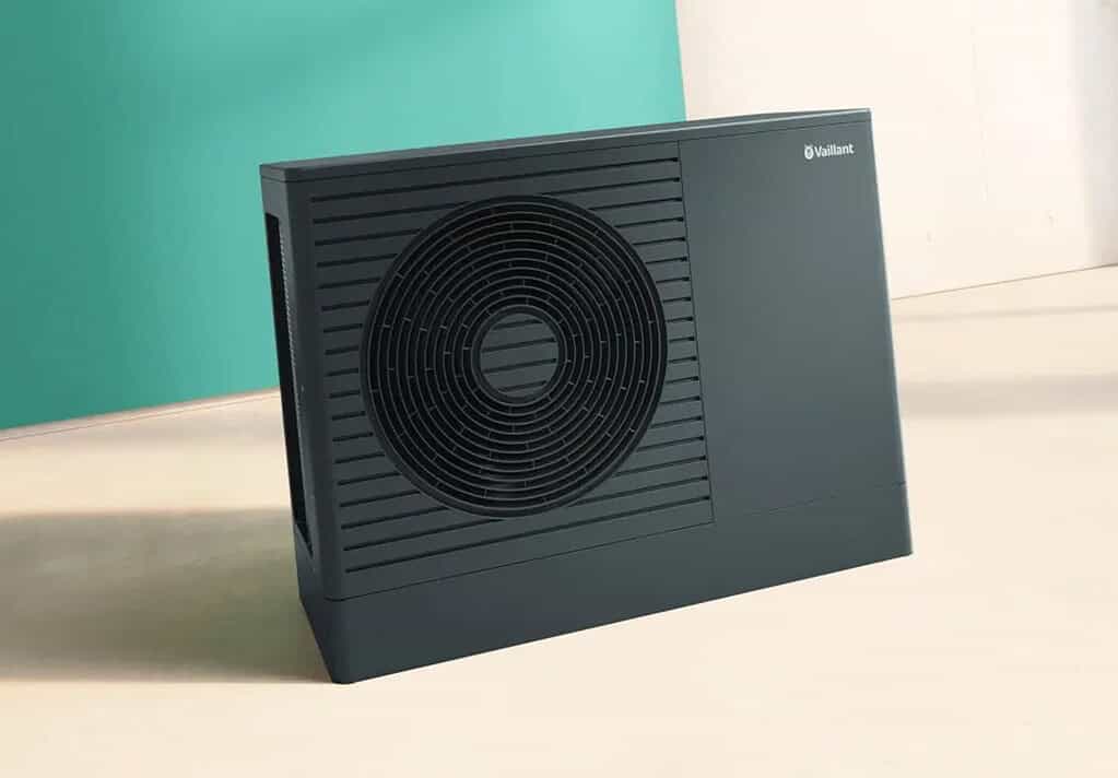 Heat pump system for energy-efficient home climate control, installed indoors for optimal performanc.
