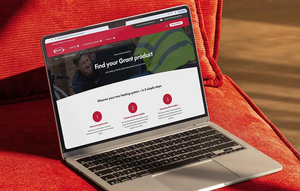 Find your grant product online - heat pump news UK website on a laptop screen.
