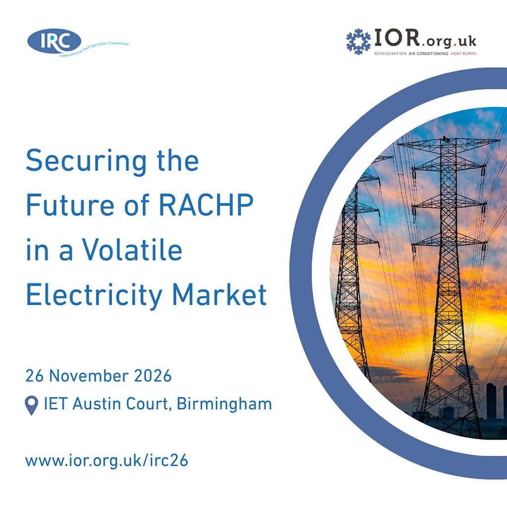 High-voltage electricity transmission tower at sunset, symbolising energy infrastructure.