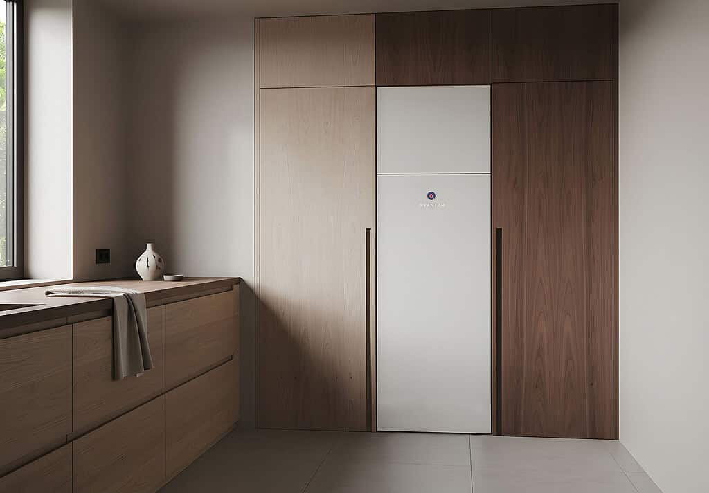 Heat pump integrated into modern wooden kitchen cabinetry for energy-efficient heating.
