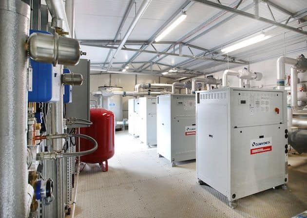 Industrial heat pump units in a modern commercial facility.