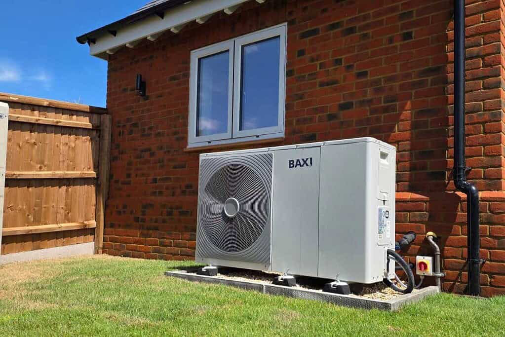 Baxi heat pump installed outside a brick house in Buckinghamshire.