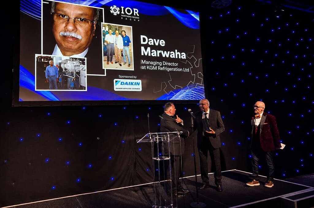 Dave Marwaha receiving IOR Northern lifetime achievement award at event.