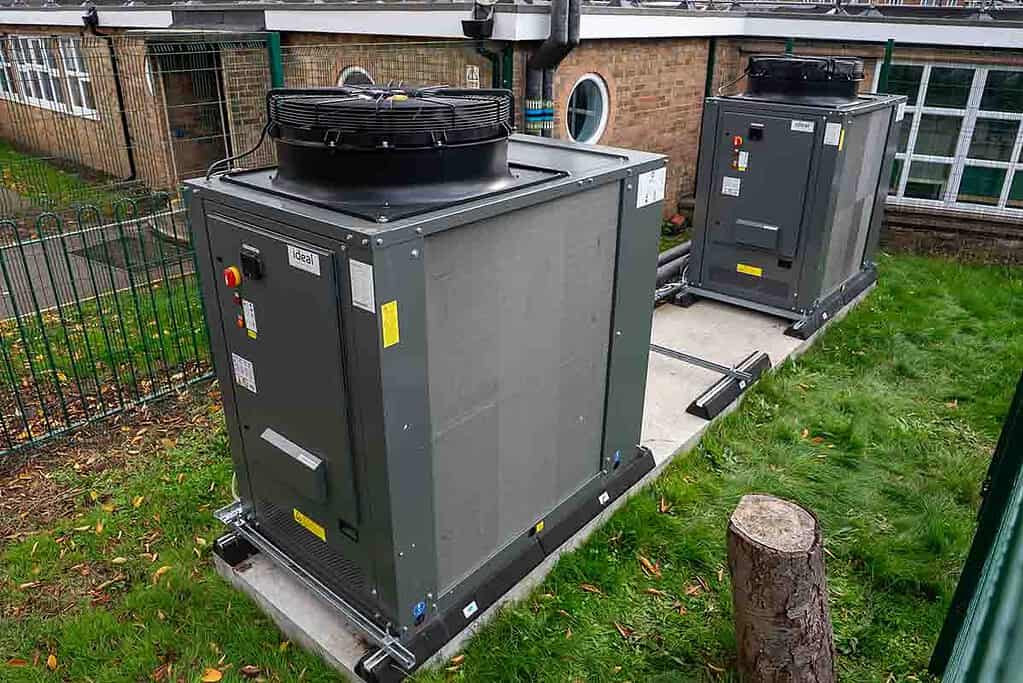 Two R290 heat pumps installed outdoors for commercial heating systems.