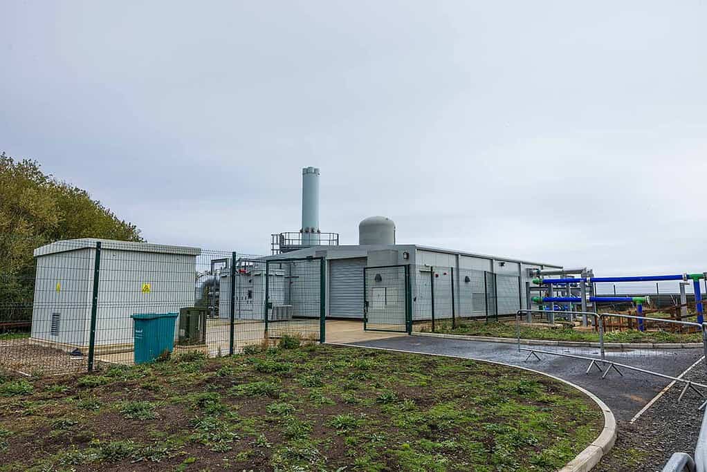 Industrial heat pump system for sustainable water heating in a renewable energy project.